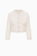 Tween tweed jacket front view in light ivory, buttoned with two flap pockets