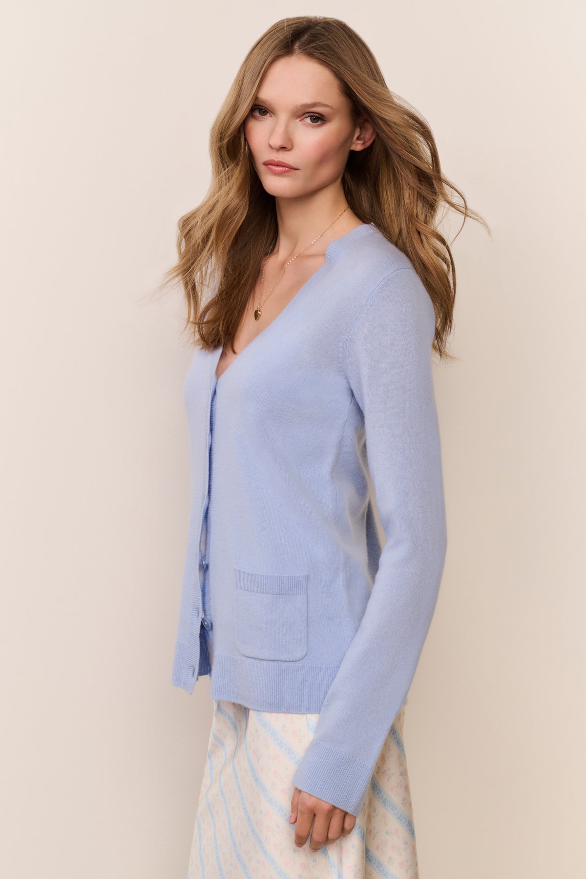 Light blue cashmere cardigan with button front, V-neck, and long sleeves