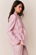 Pink double-breasted blazer with bow-tied sleeve cuffs and peaked lapels