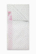 Light patchwork quilt with diamond stitching and pink floral sections
