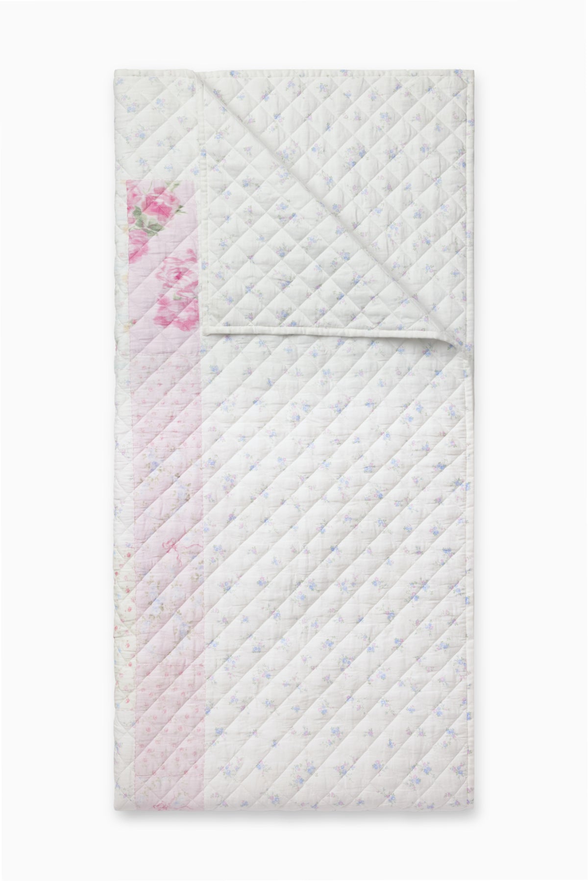 Light patchwork quilt with diamond stitching and pink floral sections