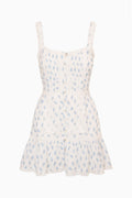 Light blue printed mini dress with square neckline, lace-trim straps, tiered ruffle hem.