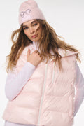 Light pink quilted puffer vest with hood, front zipper, and stand collar