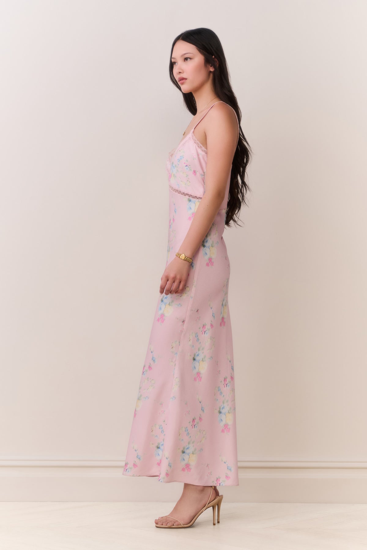 Pink floral satin maxi slip dress side view with thin lace-trim straps