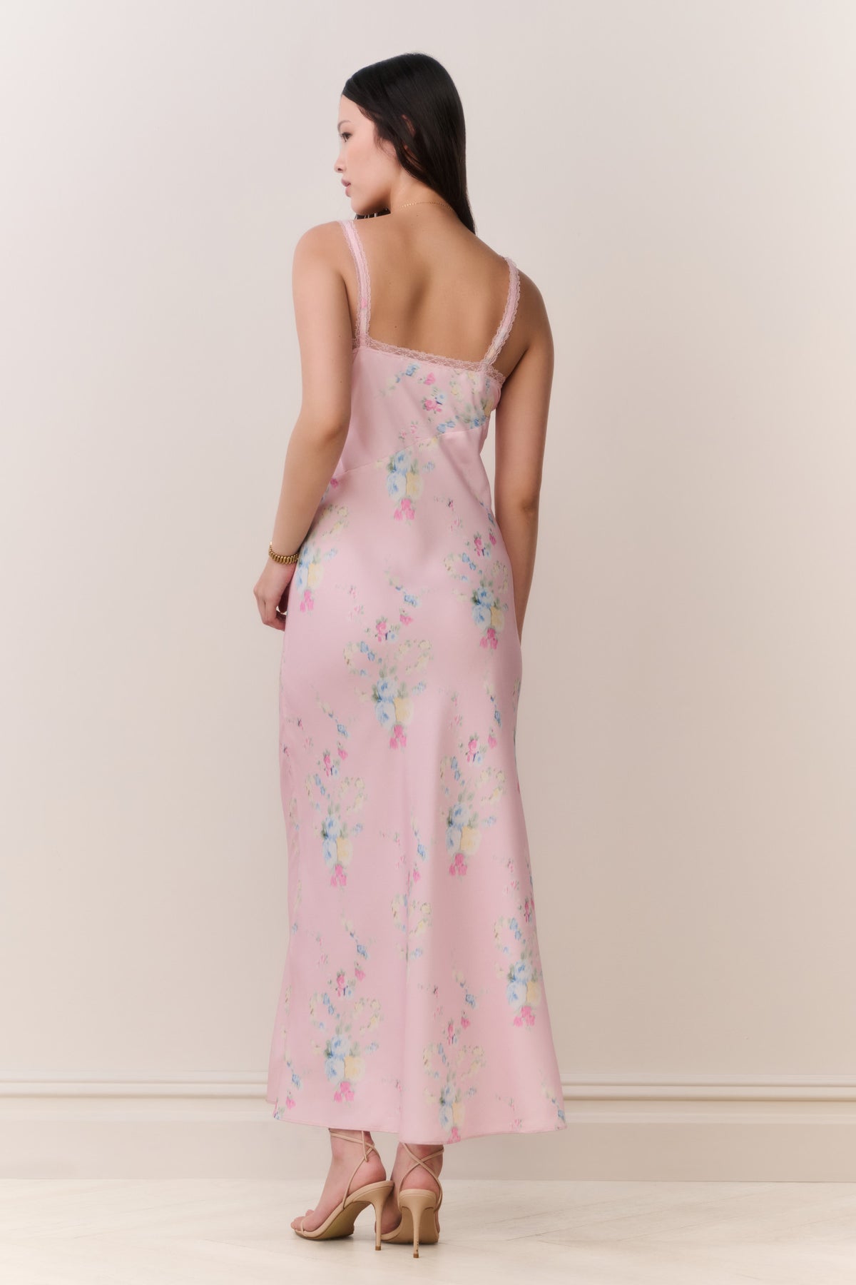 Pink floral satin maxi slip dress back view with lace-trim straps