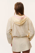 Cream windbreaker hoodie with hood and pink trim, back view