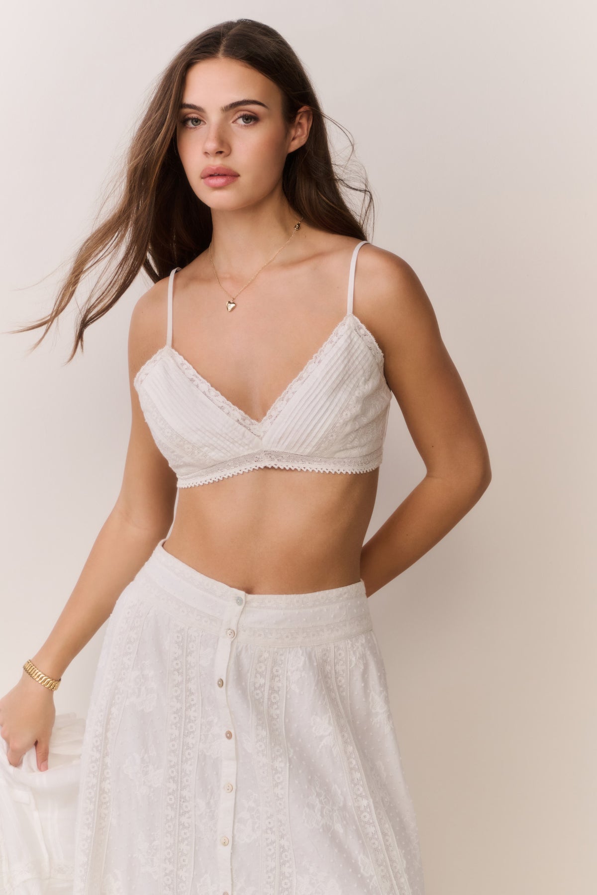 White lace cotton bralette top with V-neck and matching high-waist skirt buttons