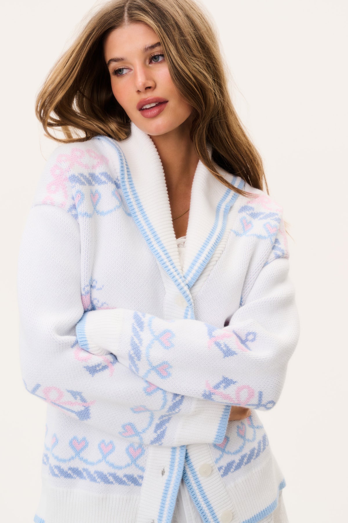 Light knit cardigan with V-neck button front and colorful nautical emblem pattern