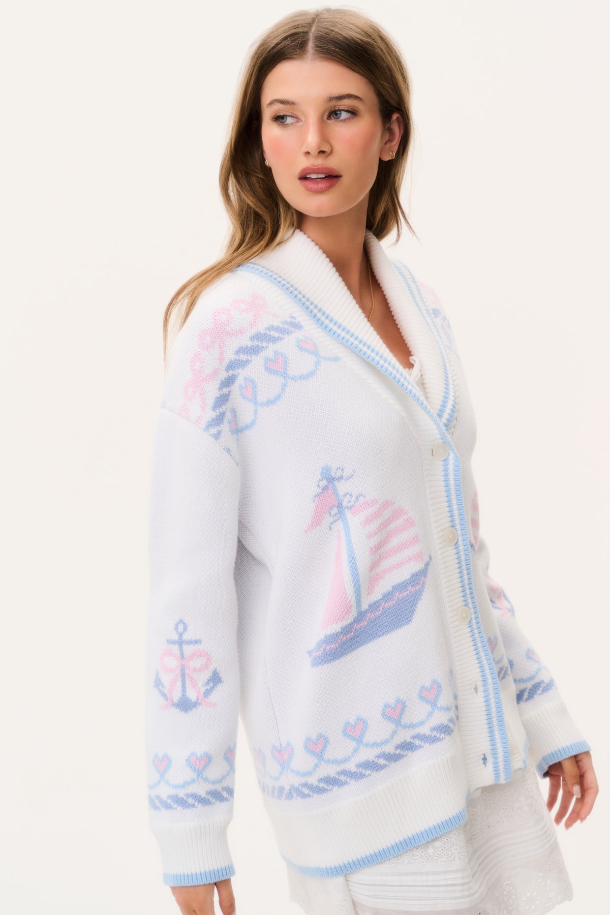 Light knit cardigan with V-neck, long sleeves, button front, blue trim and nautical print