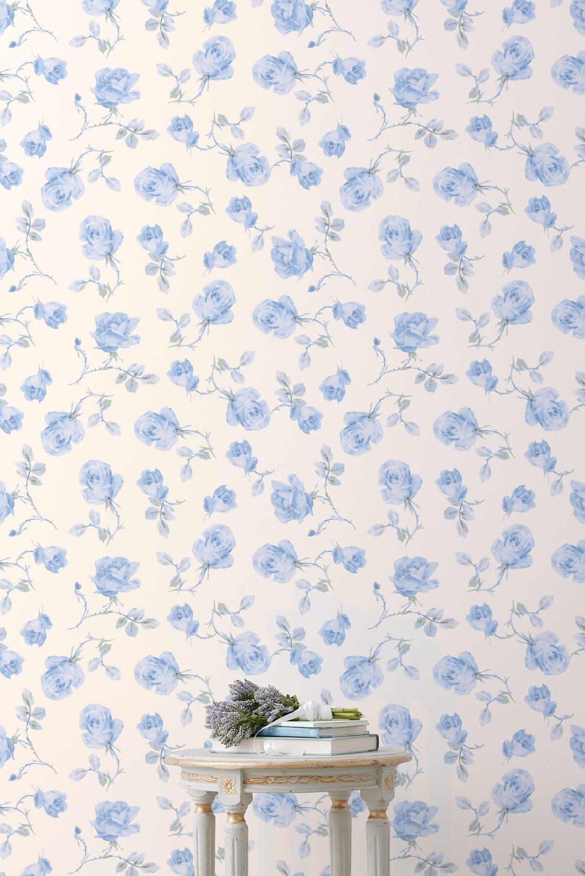 Floral wallpaper roll with light blue rose pattern on cream background