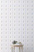 Light blue floral patterned standard wallpaper with vertical stripe design