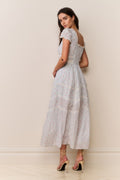 Light blue floral cotton midi dress with puff sleeves and gathered tiered skirt