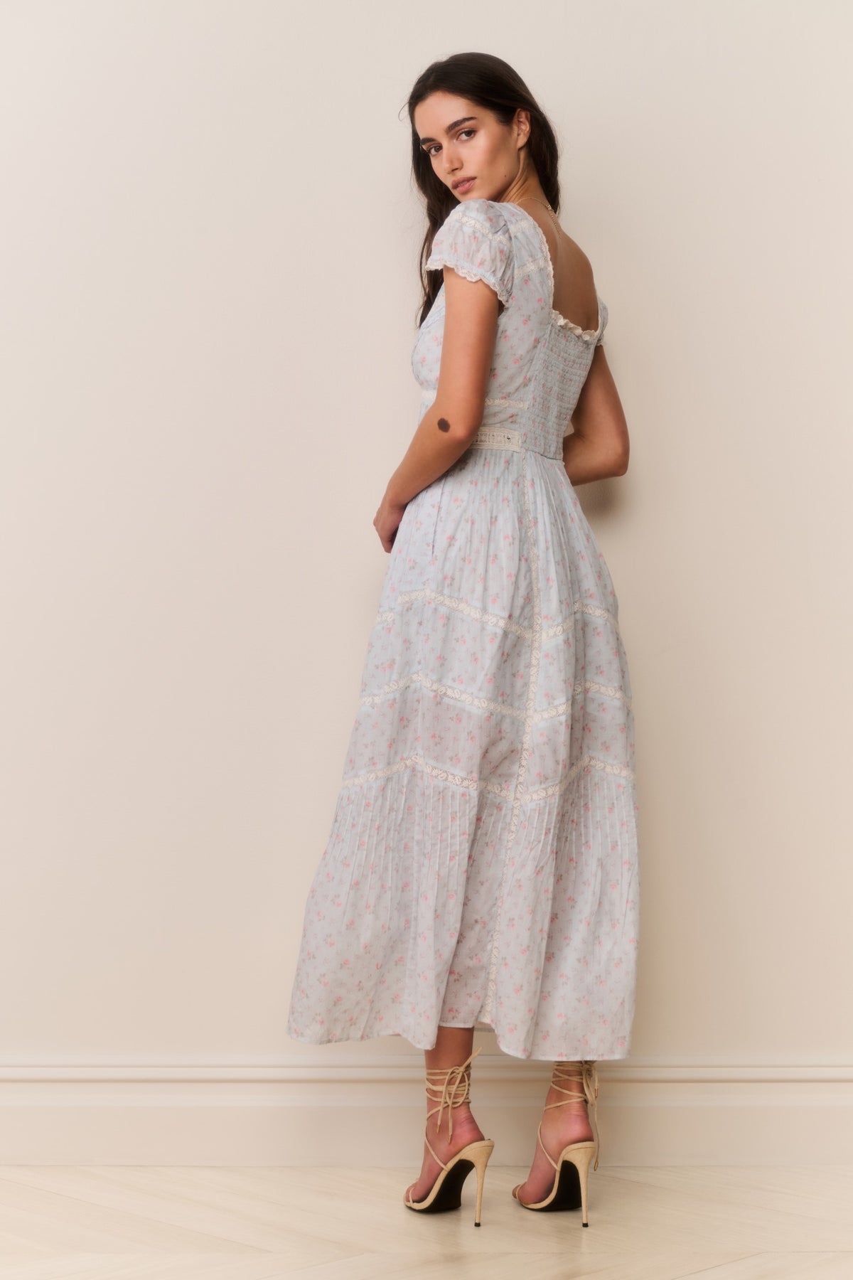 Light blue floral cotton midi dress with puff sleeves and gathered tiered skirt