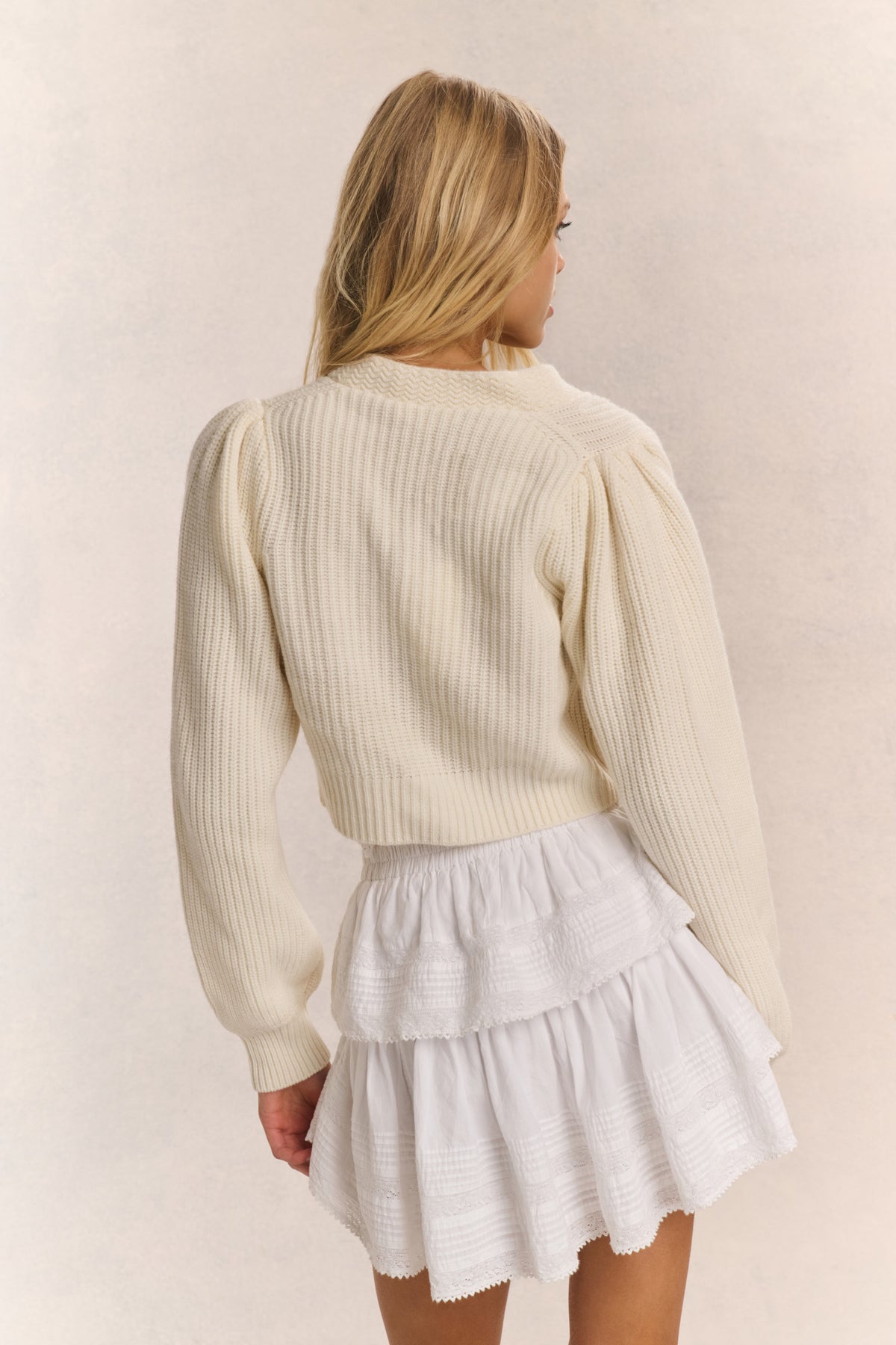 Ivory ribbed V-neck crop cardigan with button front and long sleeves (rear view)