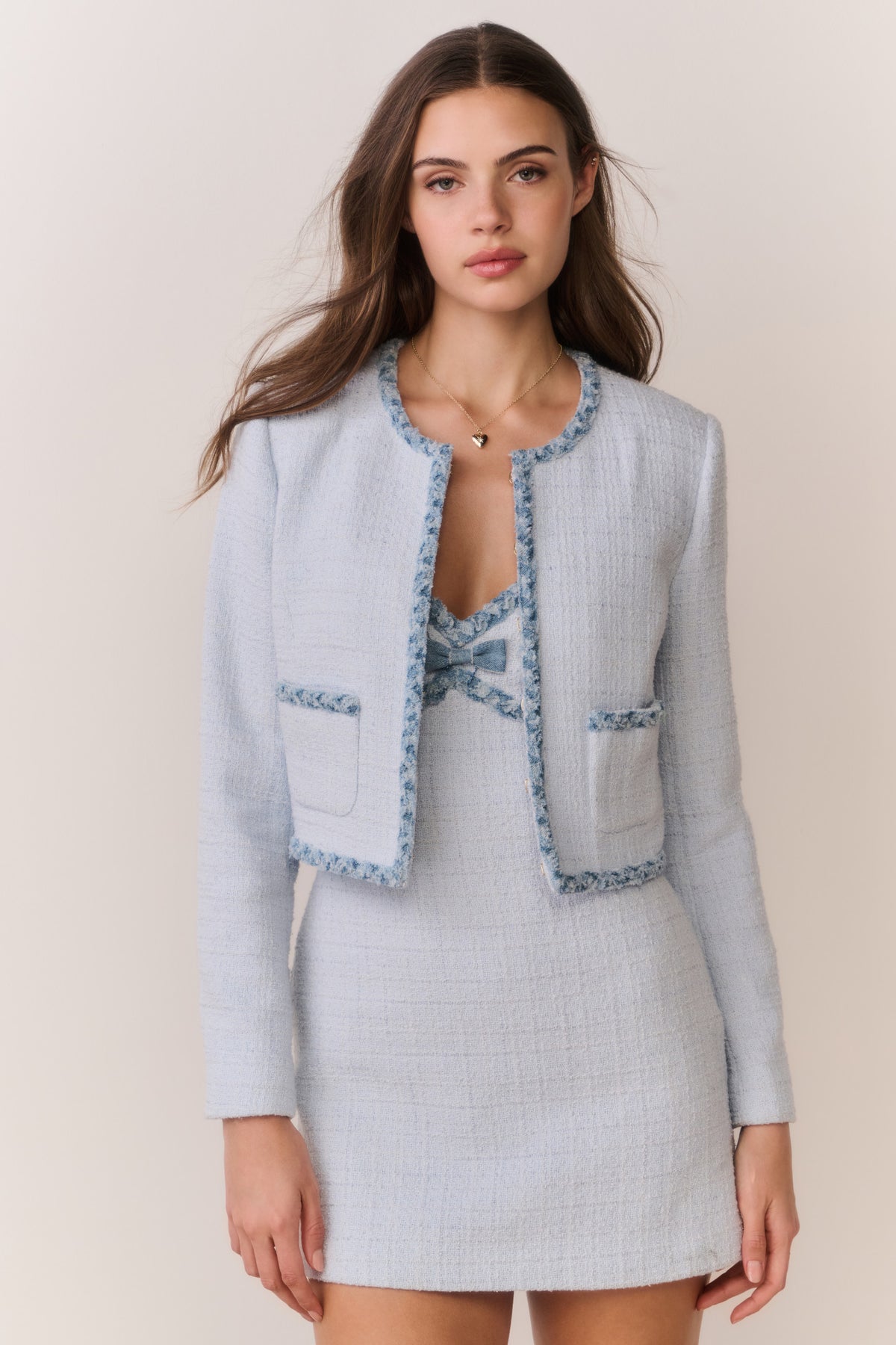 Light blue tweed jacket with denim trim, button front, flap pockets