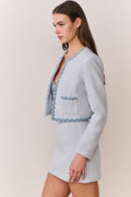 Light blue tweed jacket with denim-trimmed collar and patch pockets
