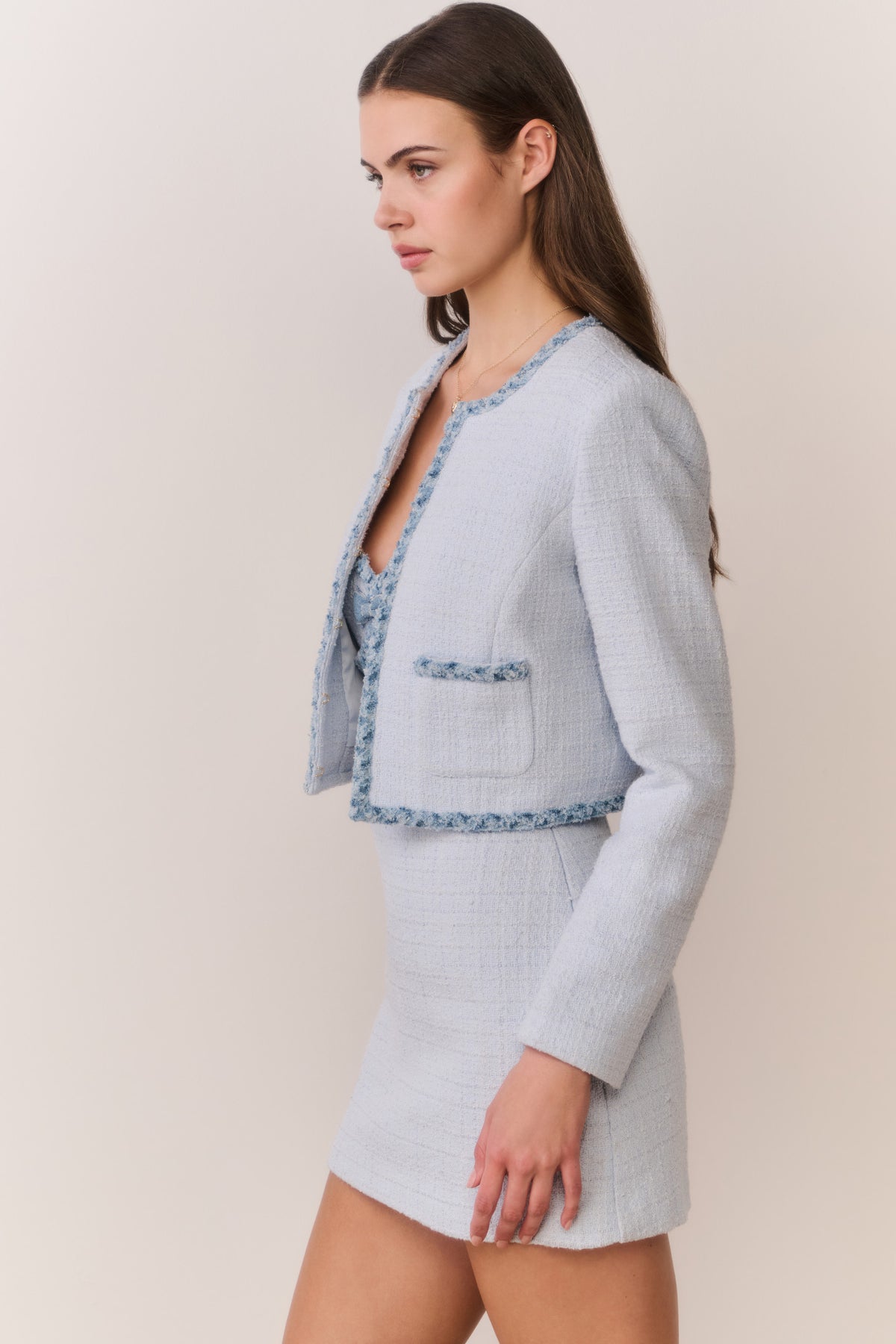 Light blue tweed jacket with denim-trimmed collar and patch pockets