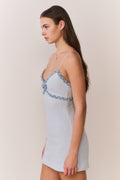 Light blue tweed mini dress with denim trim along straps and hem, side view