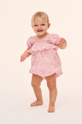 Baby pink floral pinafore with ruffle sleeves and gathered bib
