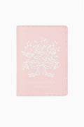 Blush pink travel case cover with embroidered crest graphic and dotted border