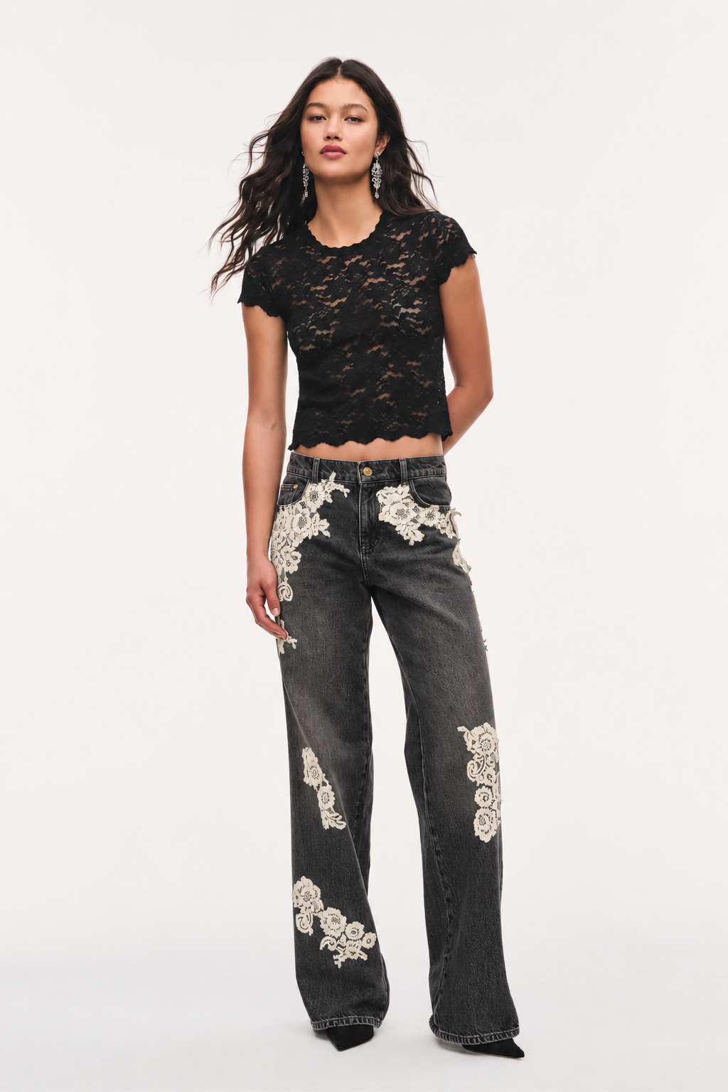 Jeans with cream lace appliqué, shown on model