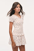 Antique vanilla smocked mini dress with V-neck, puff sleeves, floral print skirt