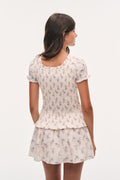 Antique vanilla smocked mini dress, floral print, short puff sleeves, tiered skirt (back)