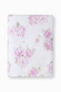 White bath towel with scattered pink floral pattern