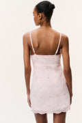 Back view of rose drift eyelet linen mini dress with lace-trimmed neckline and hem