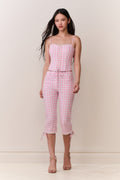 Pink gingham cotton bustier with thin straps, lace-up bodice, and drawstring waist