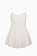 Ivory silk lace mini dress on hanger, spaghetti straps and tiered ruffle hem