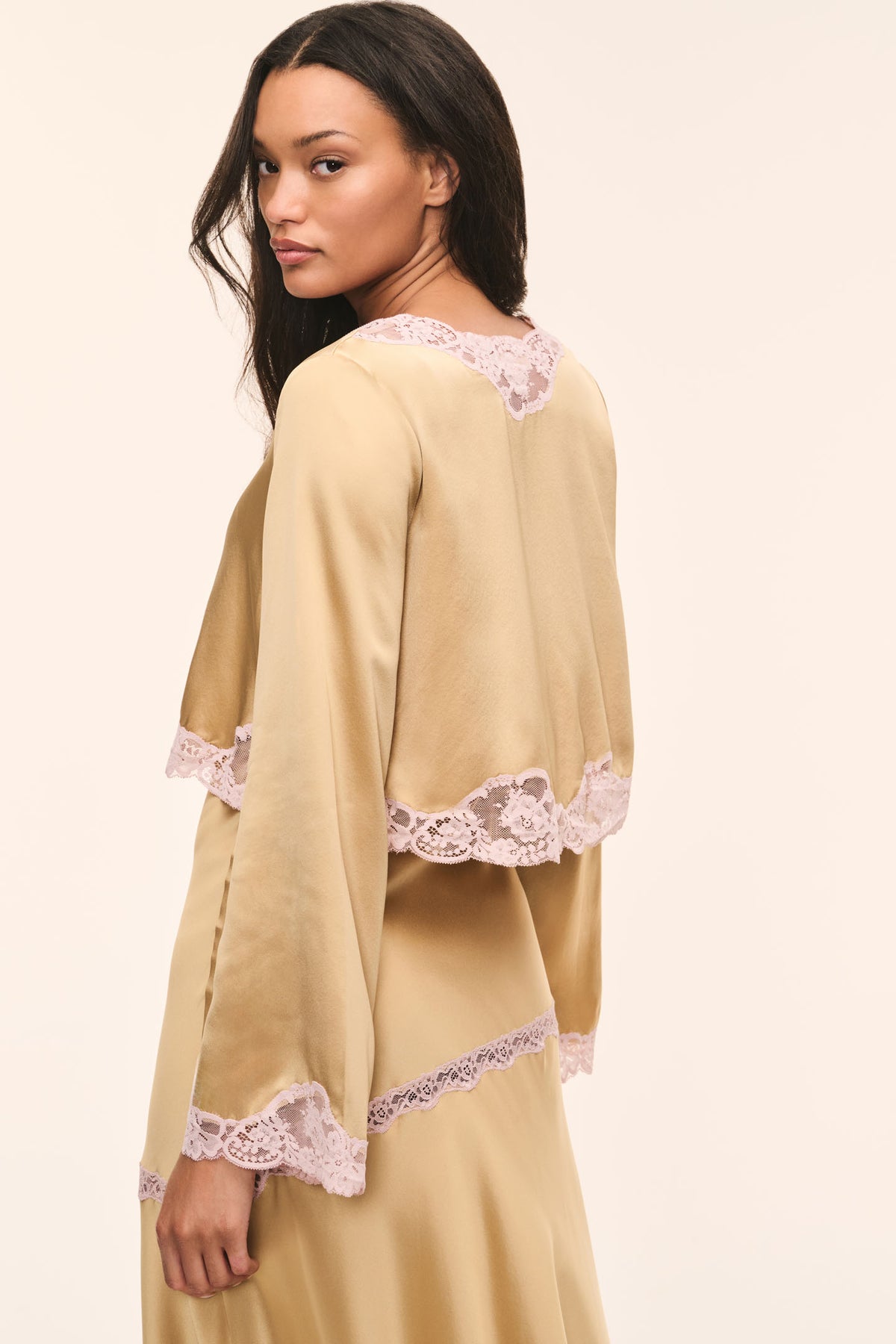 Silk lace top, back view: light tan satin with pink lace scalloped hem and cuffs