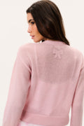 Blush-pink sheer alpaca cardigan with bow detail at back yoke