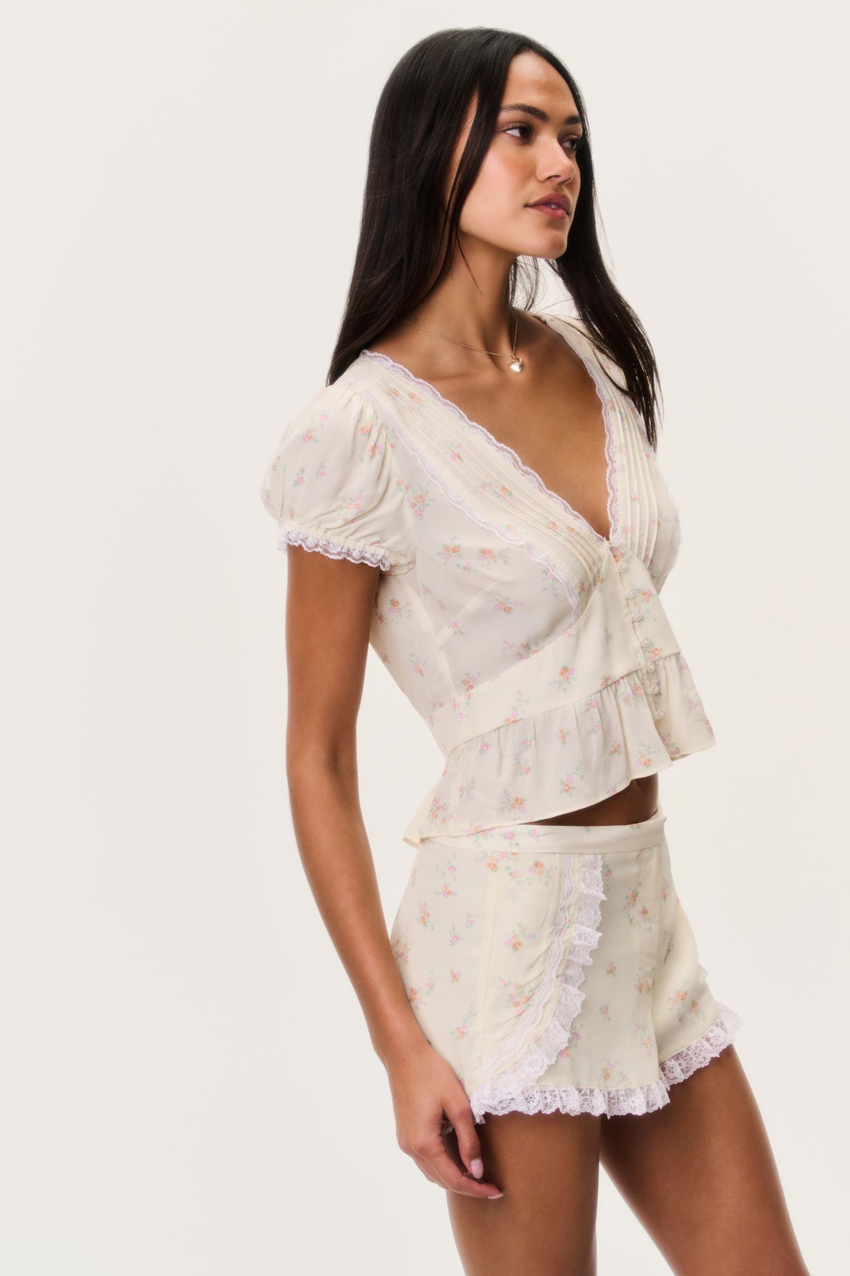 Floral lace-trimmed shorts with scalloped lace hem and gathered waist.