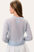 Light blue sheer alpaca cardigan back view with small bow applique