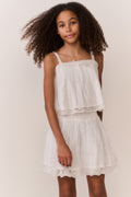 White cotton tiered skirt with elastic waist and lace hem detail, front view