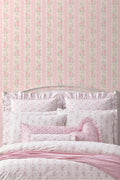 Peel-and-stick wallpaper backdrop with pink rose and green leaf pattern