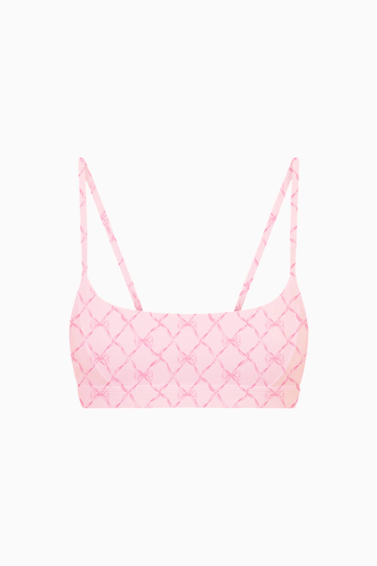 Pink sports bra with sweetheart neckline and thin straps, geometric grid print