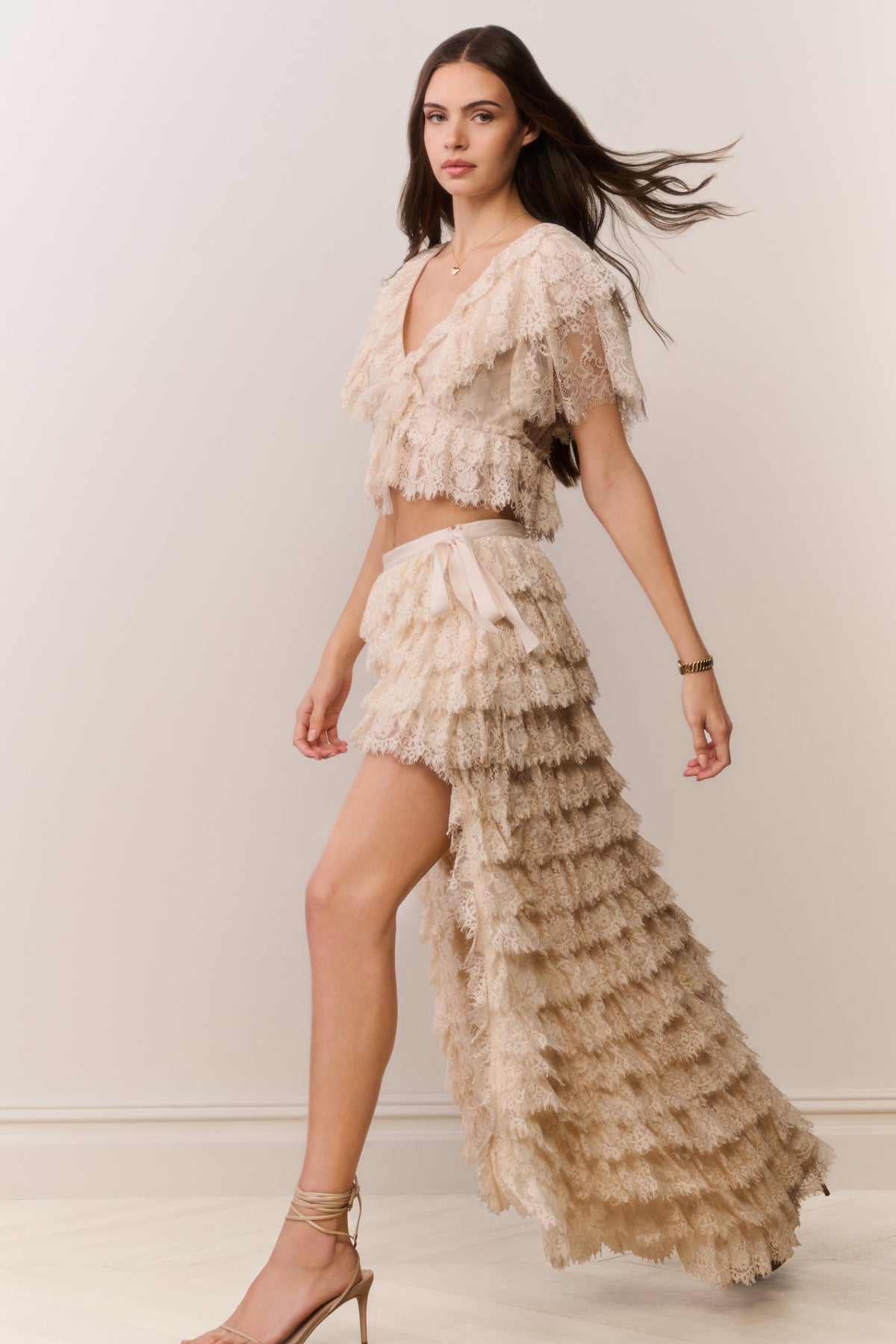 Ivory lace ruffle high-low skirt with cascading tiered ruffles and asymmetrical cut