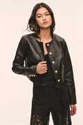 Black collarless leather jacket with gold snap button placket and two front pockets
