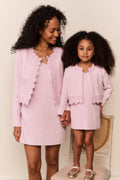 Pink lace-trimmed tweed jacket over a mini dress, front view