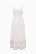 White cotton maxi dress front flat lay with thin straps and pastel embroidered button placket