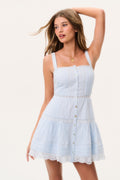 Light blue cotton mini dress with thin shoulder straps, button-front bodice, tiered skirt, lace