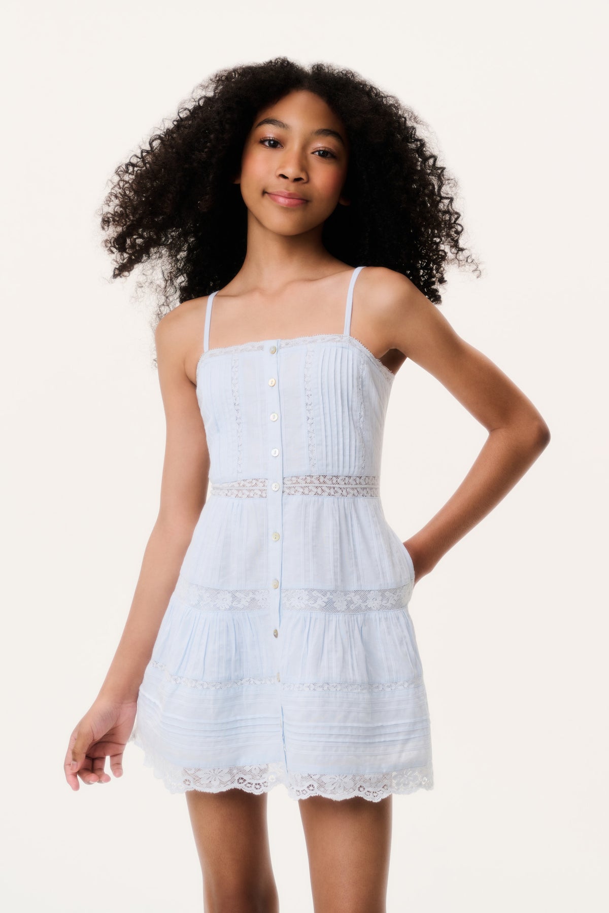Blue tween mini dress front view with button detail and lace trim at hem