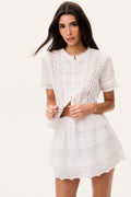 White cotton Victorian top with lace detailing, button front, and short scalloped sleeves