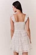 Back-view lace-trimmed cotton mini dress with ruffled straps and tiered skirt