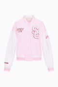 Light pink snap-front varsity jacket with 'FIGHT ON!' patch and red-outlined S emblem.
