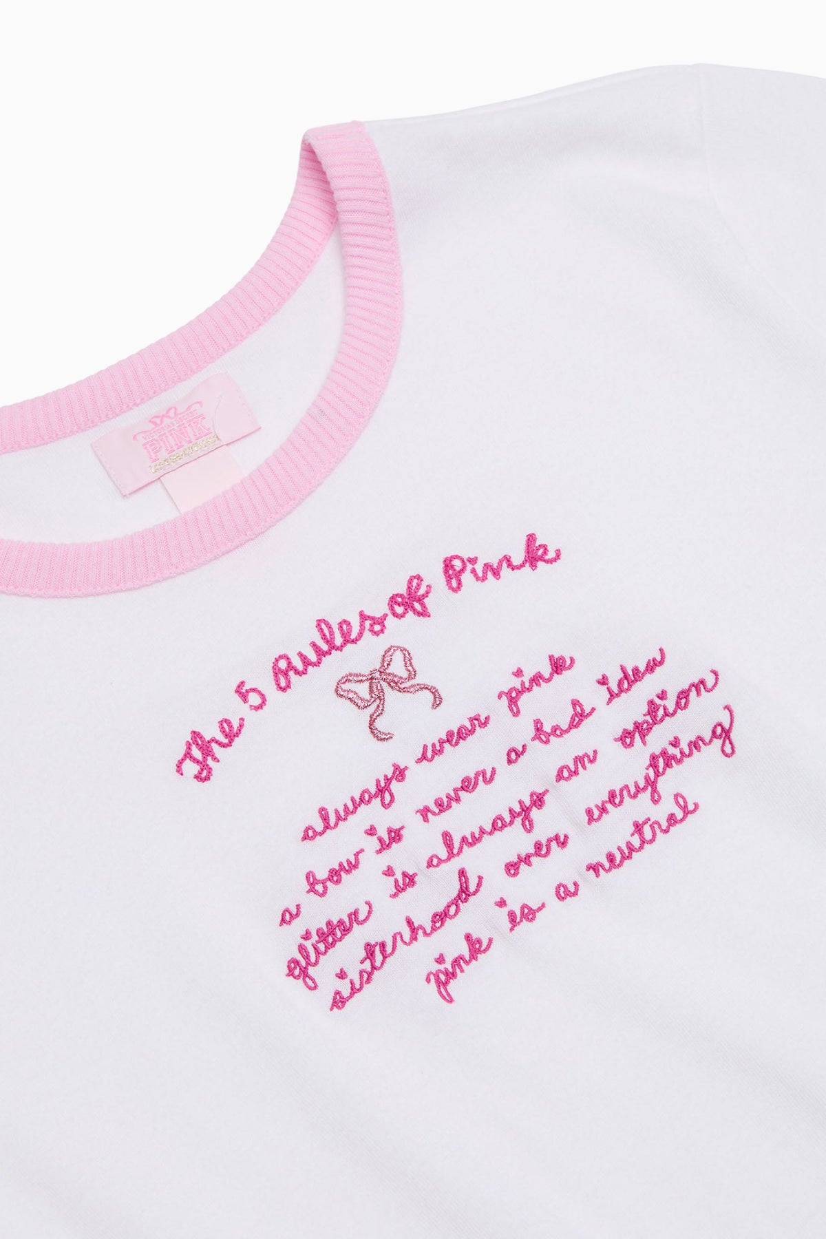 White cotton baby tee with pink โRules of Pinkโ graphic text