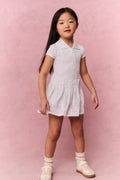 White eyelet active dress with short sleeves, collar, and gathered flared skirt
