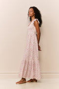 Pink floral tiered maxi dress, back view with ruffled flutter sleeves